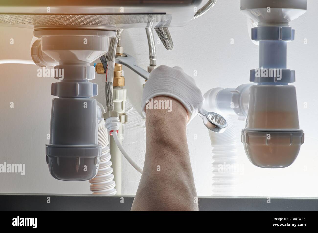 Installing drain system in kitchen close up view Stock Photo Alamy