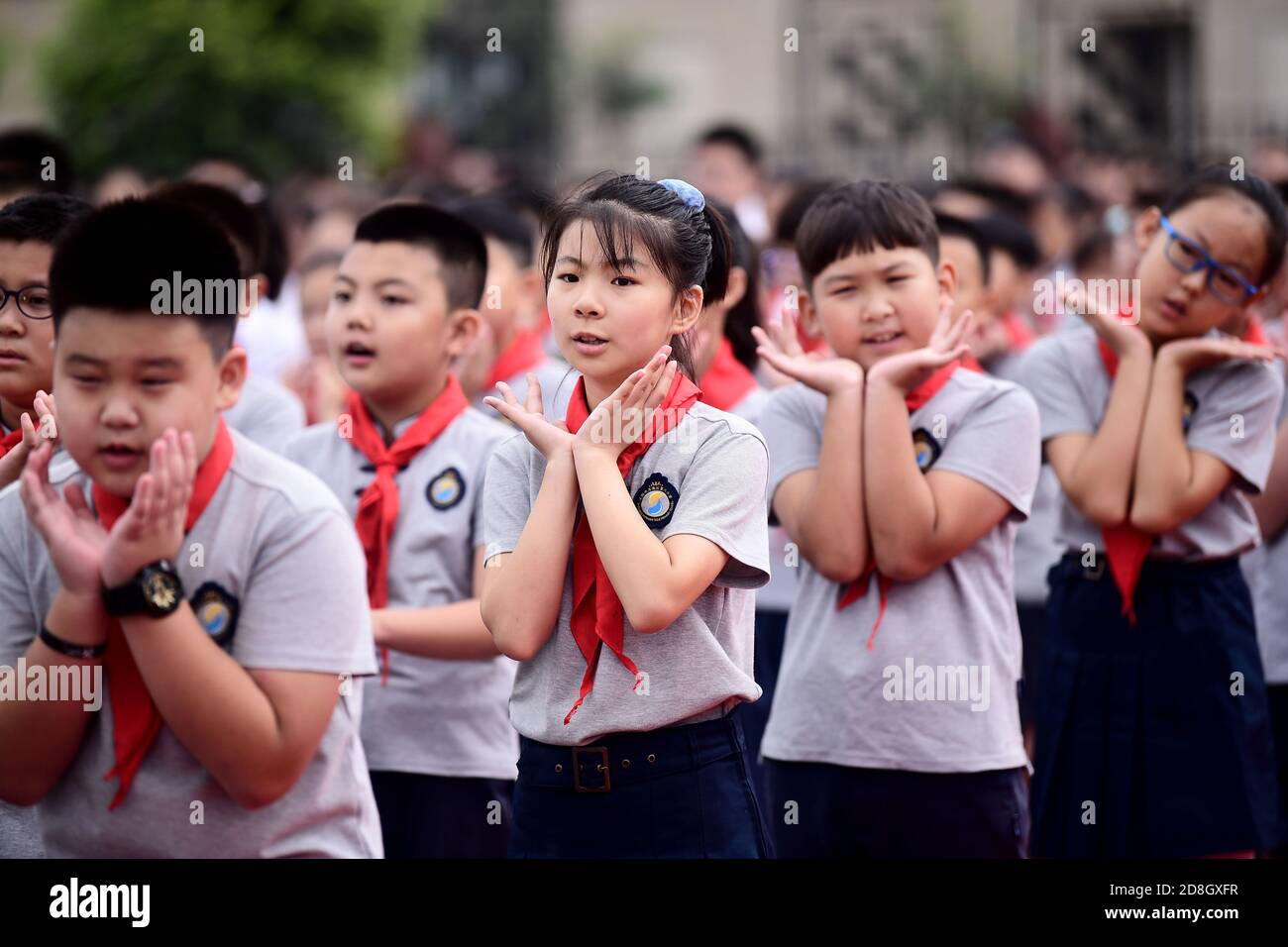 Students array on the playground, attending a ceremony to celebrate the new semester at a local primary school, Shenyang city, northeast China's Liaon Stock Photo