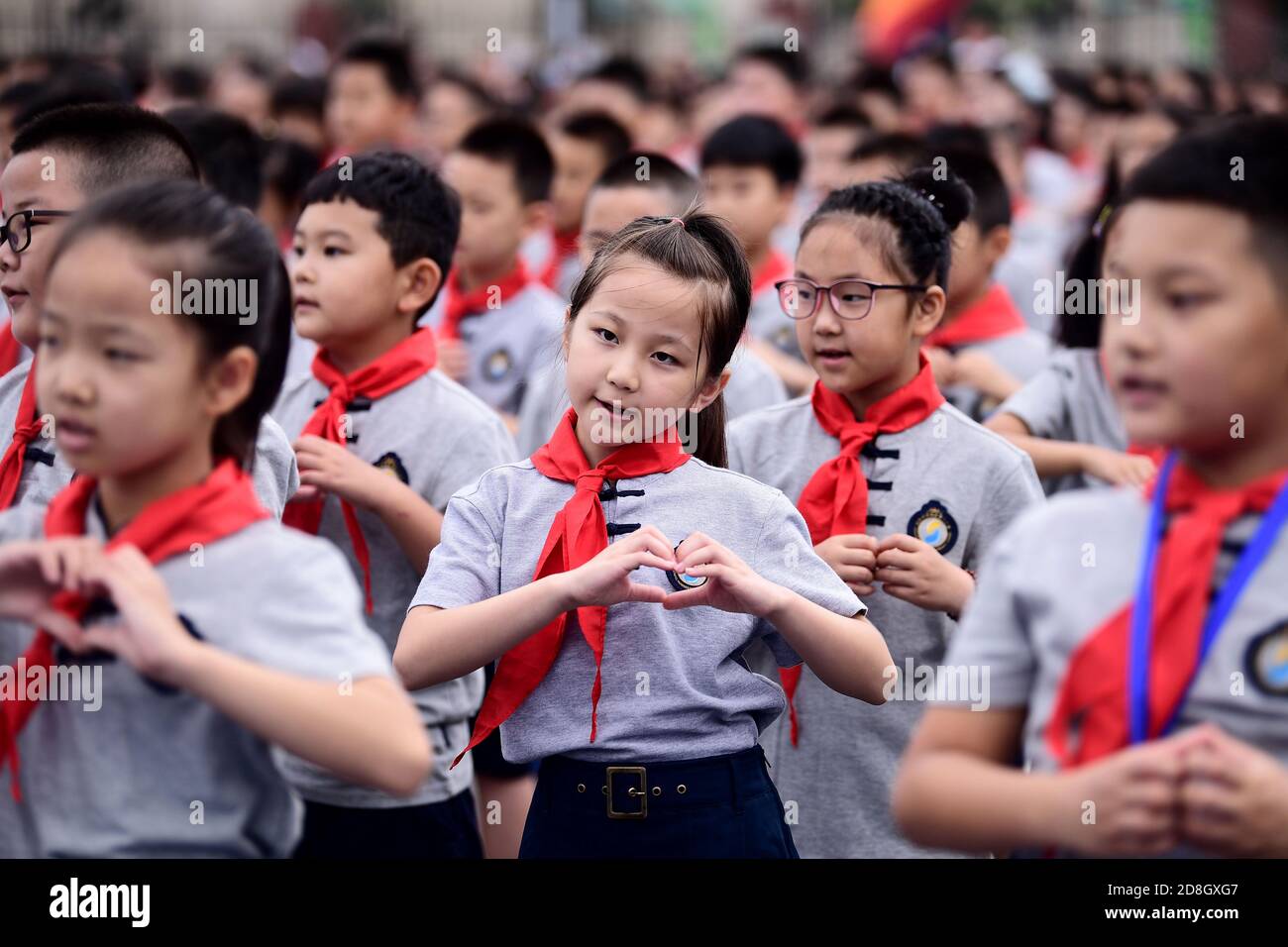 Students array on the playground, attending a ceremony to celebrate the new semester at a local primary school, Shenyang city, northeast China's Liaon Stock Photo