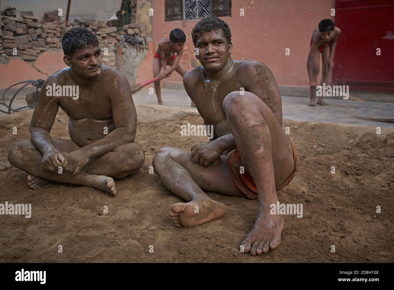 Delhi, India, May 2012.  Kushti wrestlers resting in the akhara in his daily training. Stock Photo