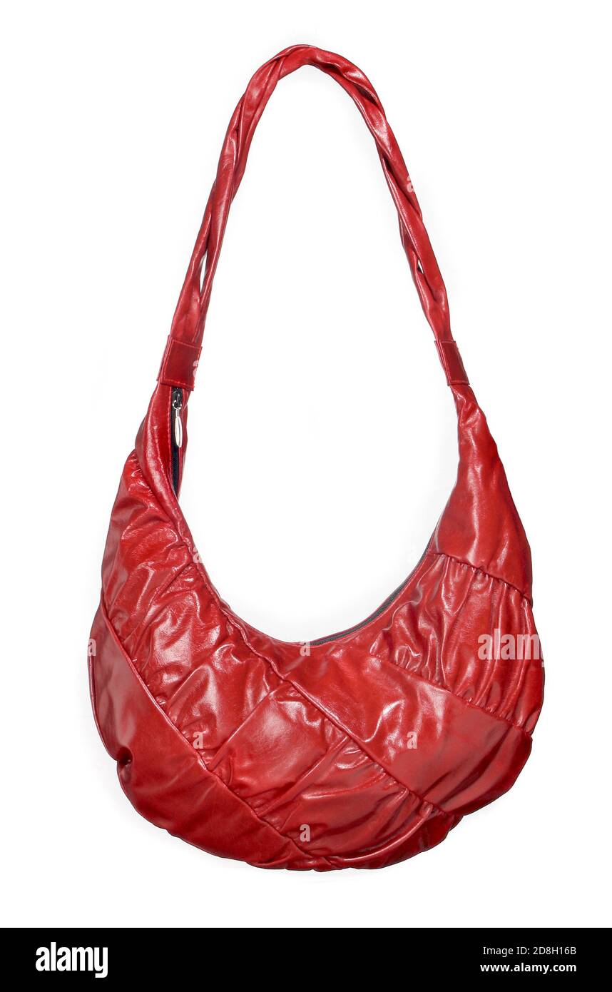 Bright red leather purse with twist pattern and handles photographed on