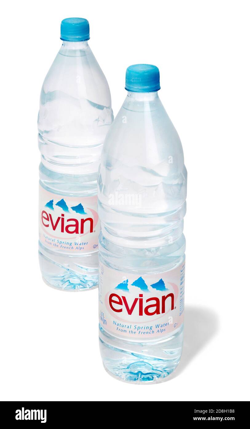 Two closed evian water bottles photographed on a white background Stock