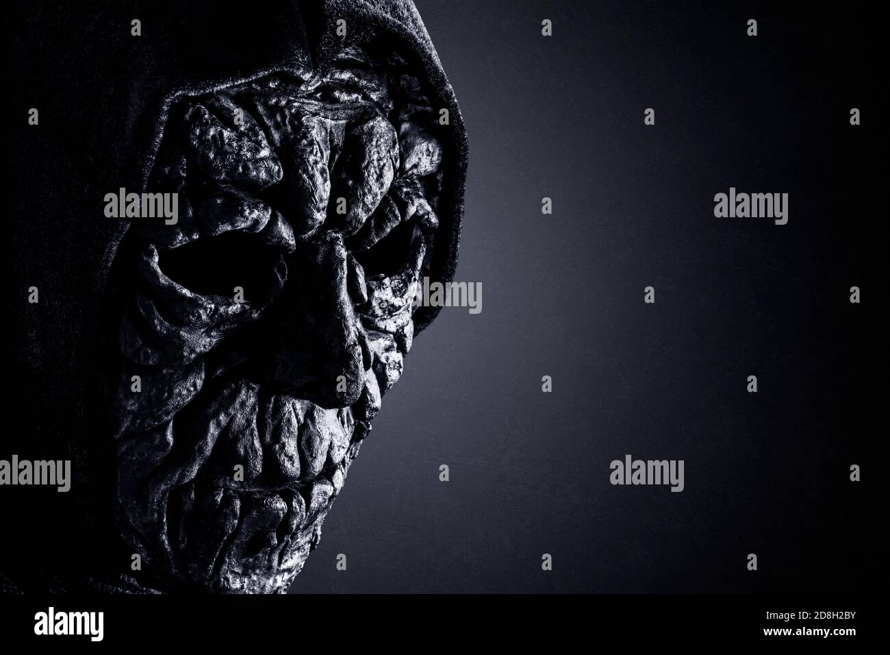 Portrait of a scary figure in hooded cloak Stock Photo