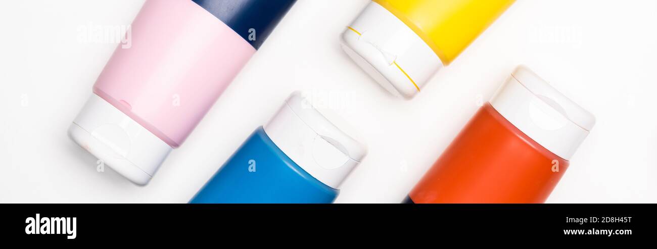 top view of acrylic paint tubes on white background, panoramic shot Stock Photo