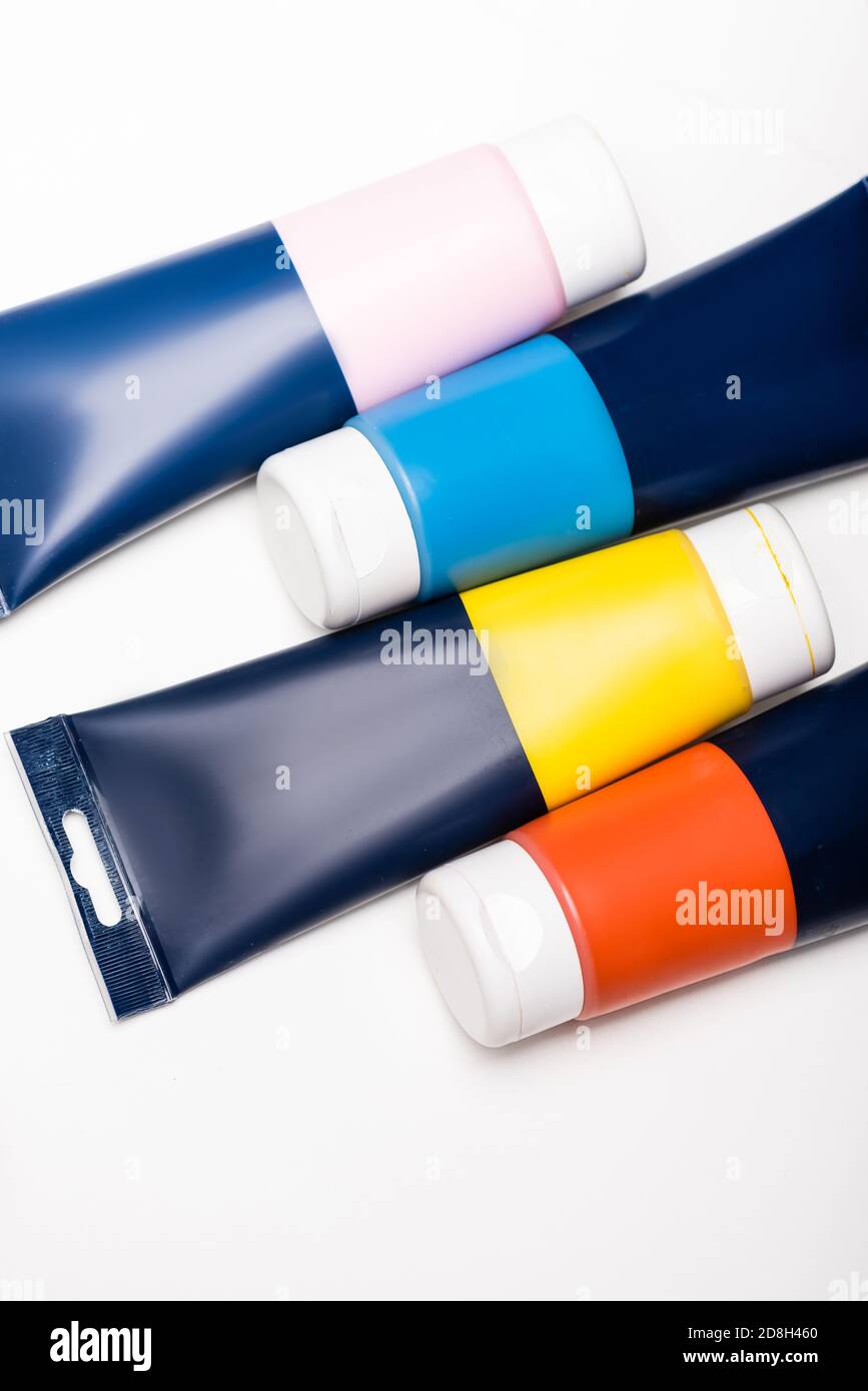 top view of acrylic paint tubes on white background Stock Photo