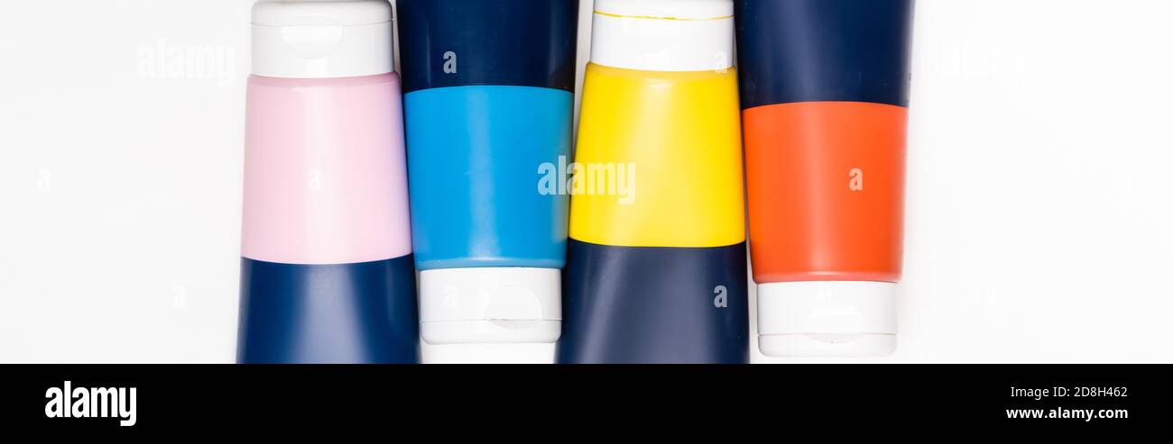 top view of acrylic paint tubes on white background, panoramic shot Stock Photo