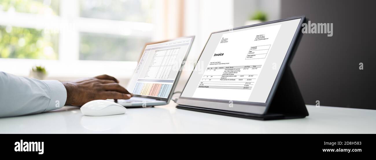 Analyze Spreadsheet Data On Laptop At Work Stock Photo
