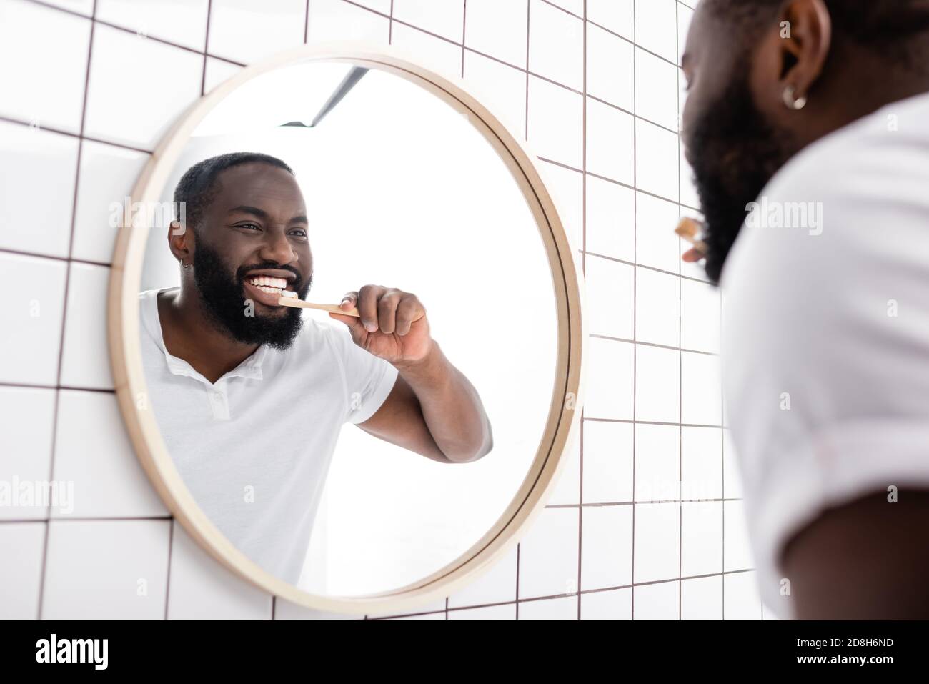 Man Brushing Teeth In Mirror