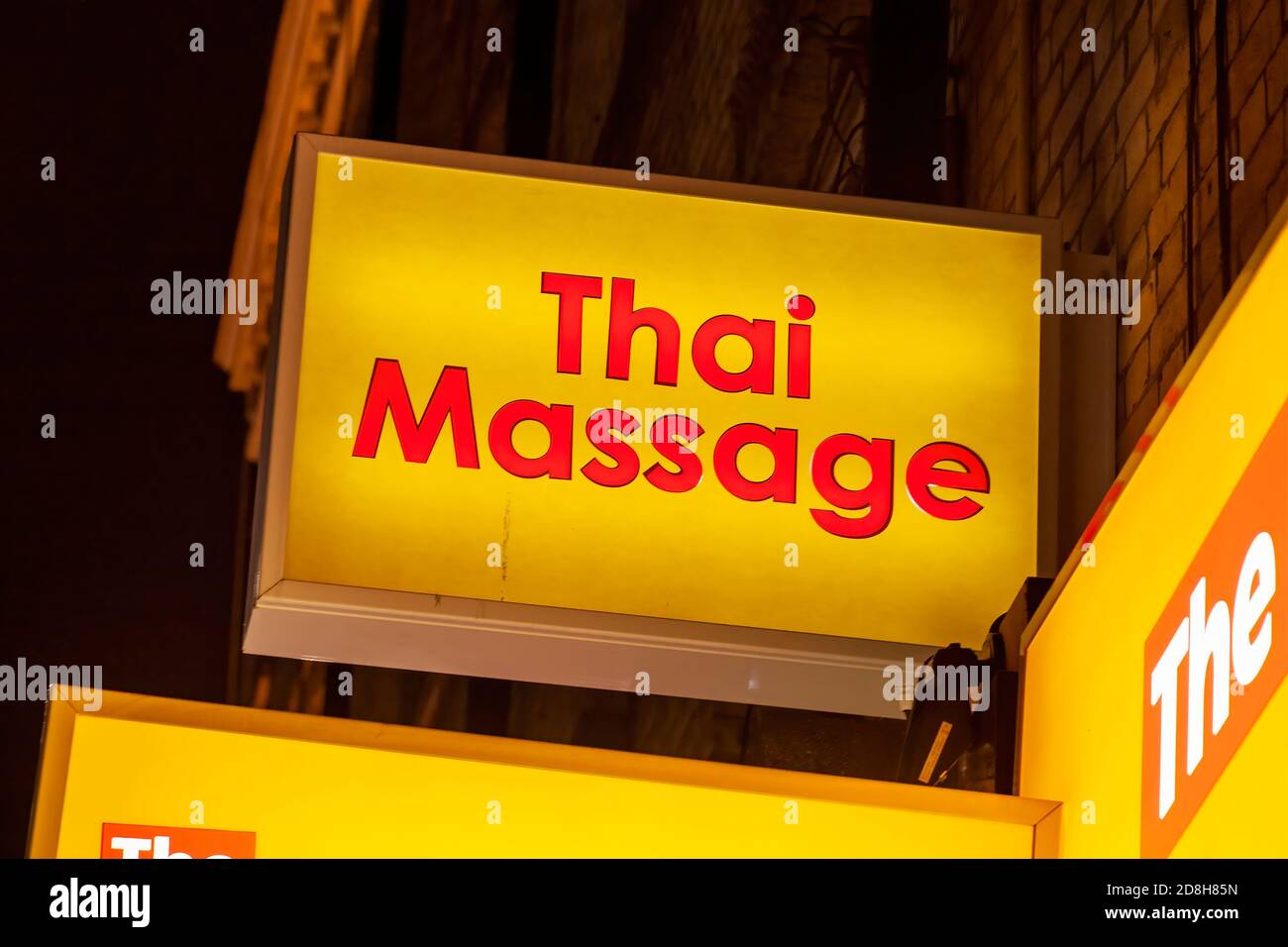 Thai massage sex shop neon sign advertising an adult licensed