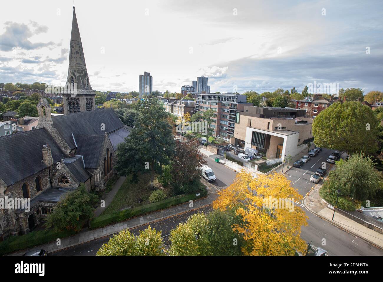 The London suburb of Belsize Park photographed from high overlooking a historic church (St Saviour) and a modern synagogue (South Hampstead), Eton Rd Stock Photo