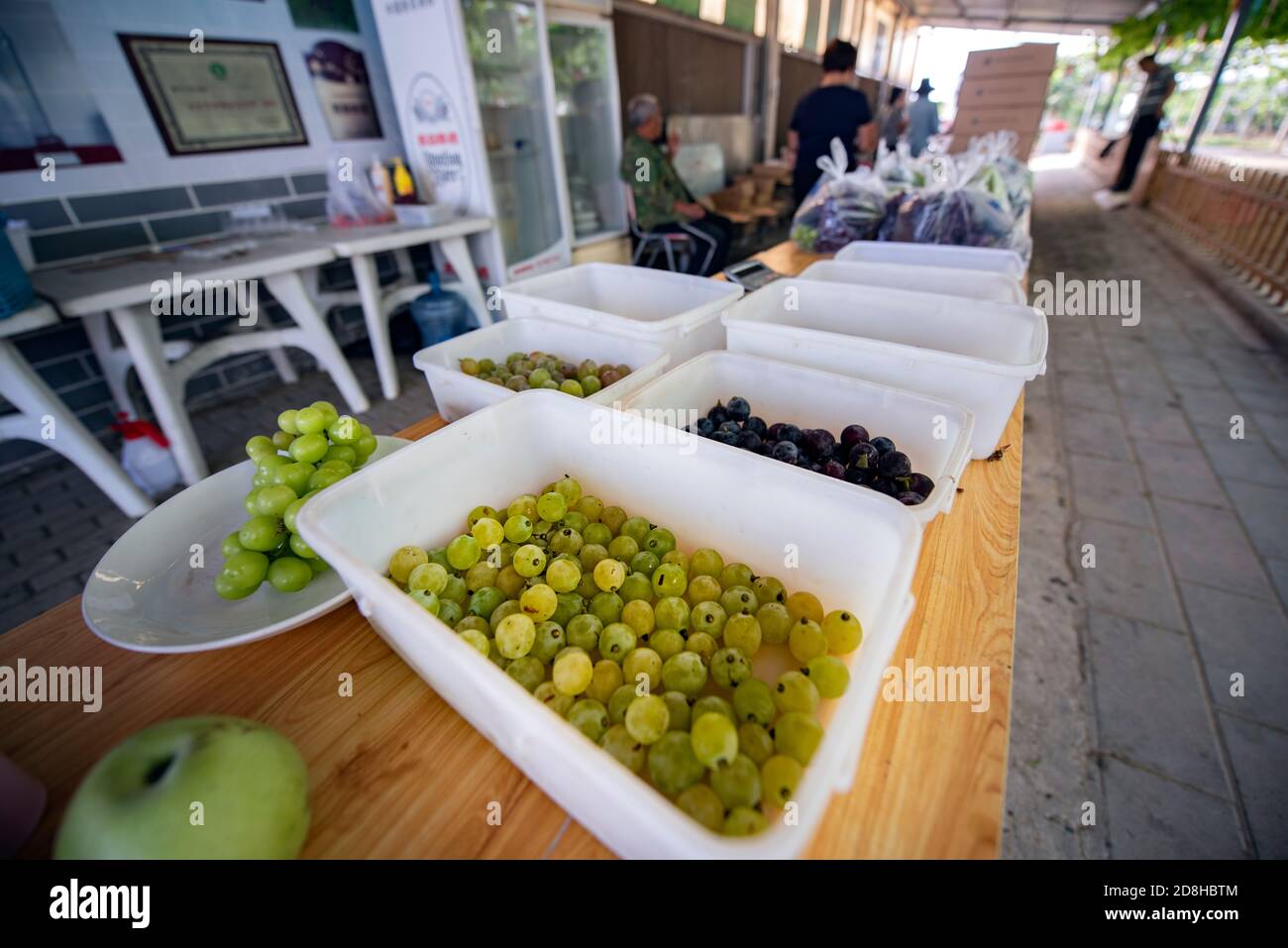 People organize grapes picked from Xiangyi Grape Farm in Beijing, China ...