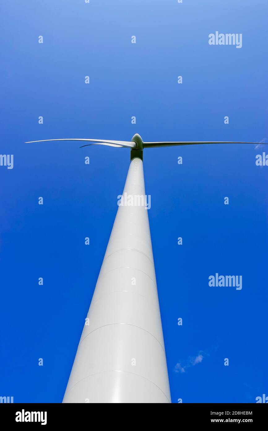 High Wind turbine against a clear blue summer sky Stock Photo