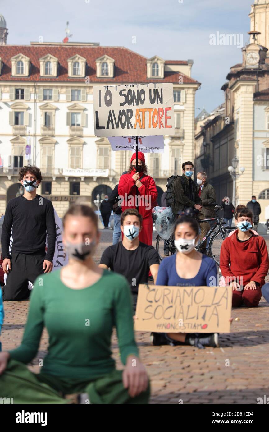 Turin, Italy. 30th Oct, 2020. People working in the cultural and entertainment sector demonstrate with facemasks to highlight the plight facing the entertainment industry and its workers brought about by the COVID-19 pandemic. Credit: MLBARIONA/Alamy Live News Stock Photo