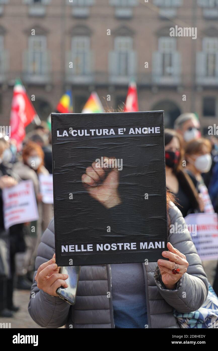 Turin, Italy. 30th Oct, 2020. People working in the cultural and entertainment sector demonstrate with facemasks to highlight the plight facing the entertainment industry and its workers brought about by the COVID-19 pandemic. Credit: MLBARIONA/Alamy Live News Stock Photo