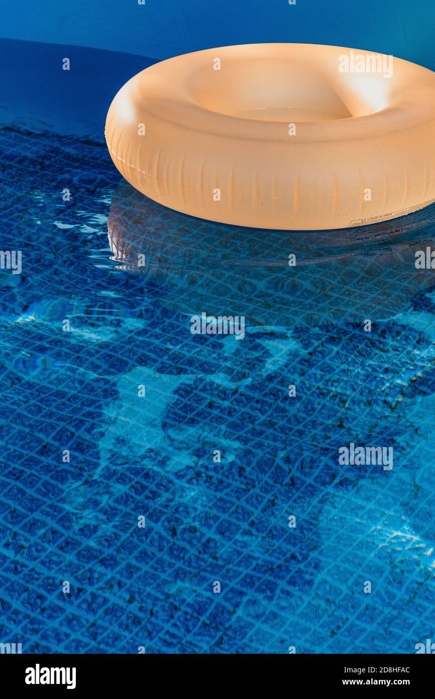 An orange pool ring in a swimming pool Stock Photo - Alamy