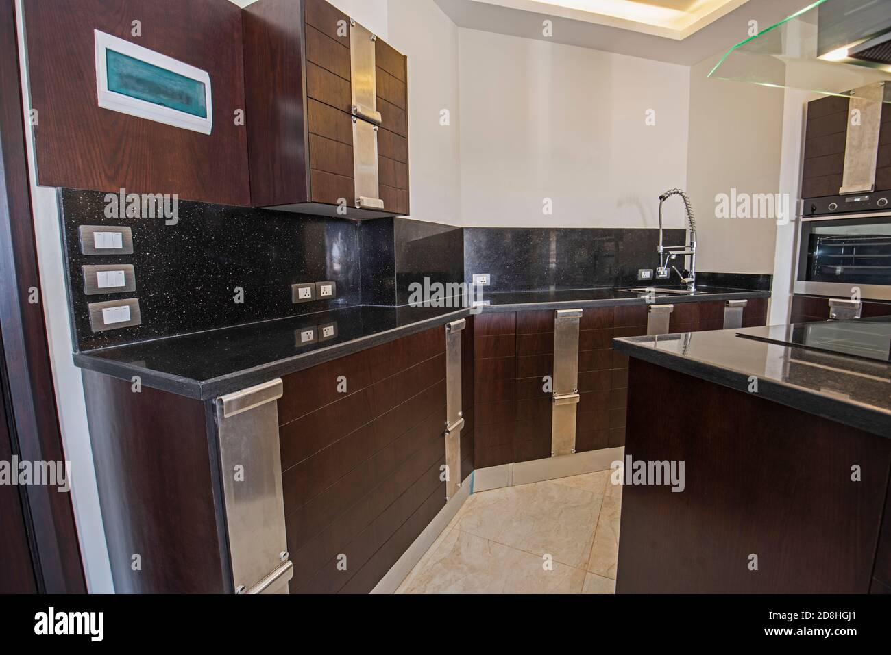 Interior design decor showing modern kitchen with cupboards in luxury apartment showroom Stock Photo
