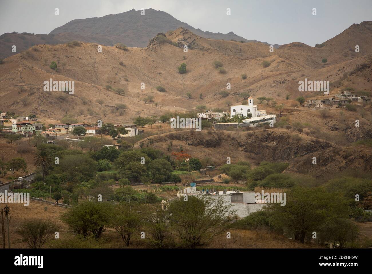 Green rural farmland lies at the base of a valley on the island of Santiago, Cabo Verde. Stock Photo