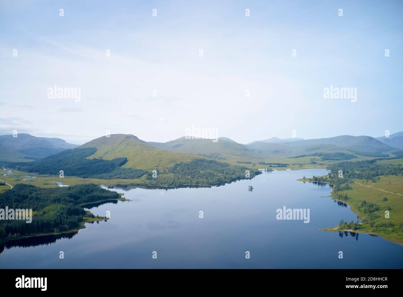Mindfulness calm background banner of aerial view from above loch at sunrise in Scotland Stock Photo