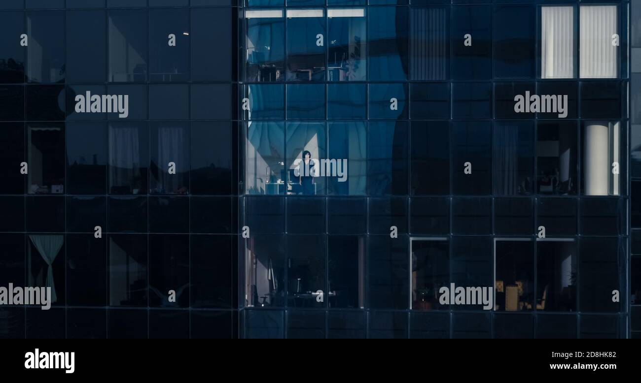 Aerial Shot from the Outside Into Office Building with Businessman