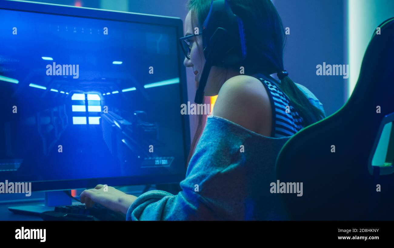 Pro Player Gamer Young Asian Woman Playing Online Video Game Shooting Fps  Tournament Ranking Cyber Internet At Night Red Neon Light Room With Gaming  Headset And Keyboard On Championship Event Stock Photo 