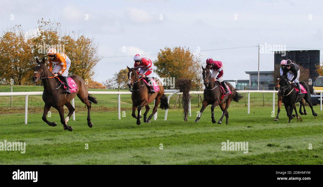 Down Royal Racecourse, Lisburn, Northern Ireland. 30 Oct 2020. The Ladbrokes Festival of Racing (Day 1) got underway today.The feature race of the day was the WKD Hurdle (Grade 2) with just under £36,000 for the winner. The race was won by Aspire Tower (3 – orange top) ridden by Rachael Blackmore and trained by H de Bromhead. Credit: CAZIMB/Alamy Live News. Stock Photo