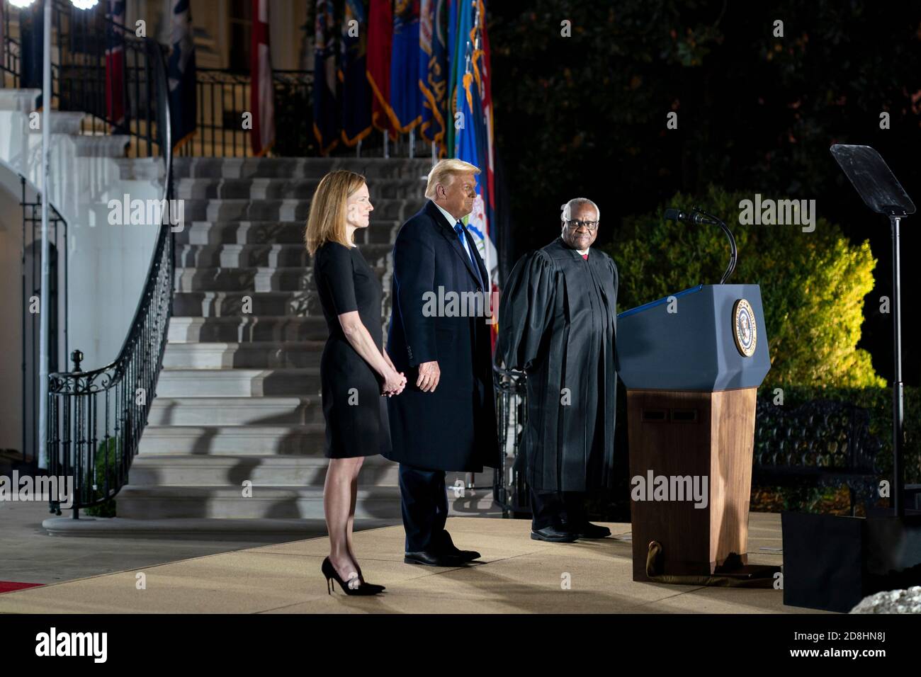Supreme Court Associate Justice Amy Coney Barrett during her swearing in ceremony on the South Lawn of the White House October 26, 2020 in Washington, DC. Joining Barrett onstage are President Donald Trump and Supreme Court Associate Justice Clarence Thomas. Stock Photo