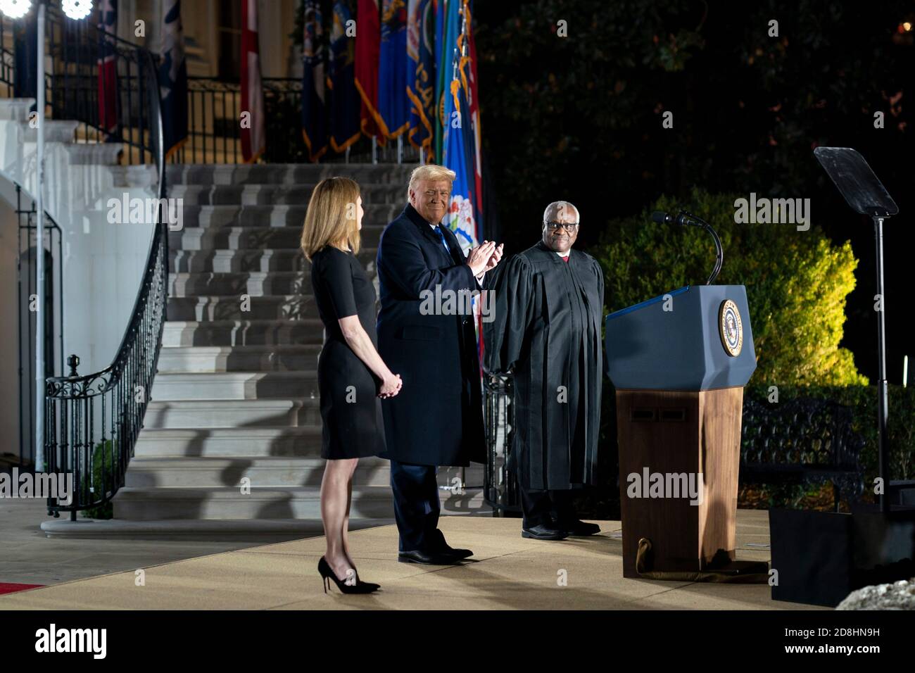 Supreme Court Associate Justice Amy Coney Barrett during her swearing in ceremony on the South Lawn of the White House October 26, 2020 in Washington, DC. Joining Barrett onstage are President Donald Trump and Supreme Court Associate Justice Clarence Thomas. Stock Photo