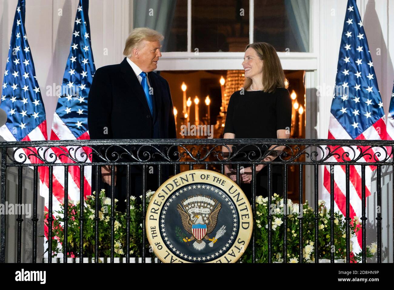 U.S President Donald Trump with Supreme Court Associate Justice Amy Coney Barrett on the Blue Room Balcony of the White House following the swearing in ceremony October 26, 2020 in Washington, DC. Stock Photo