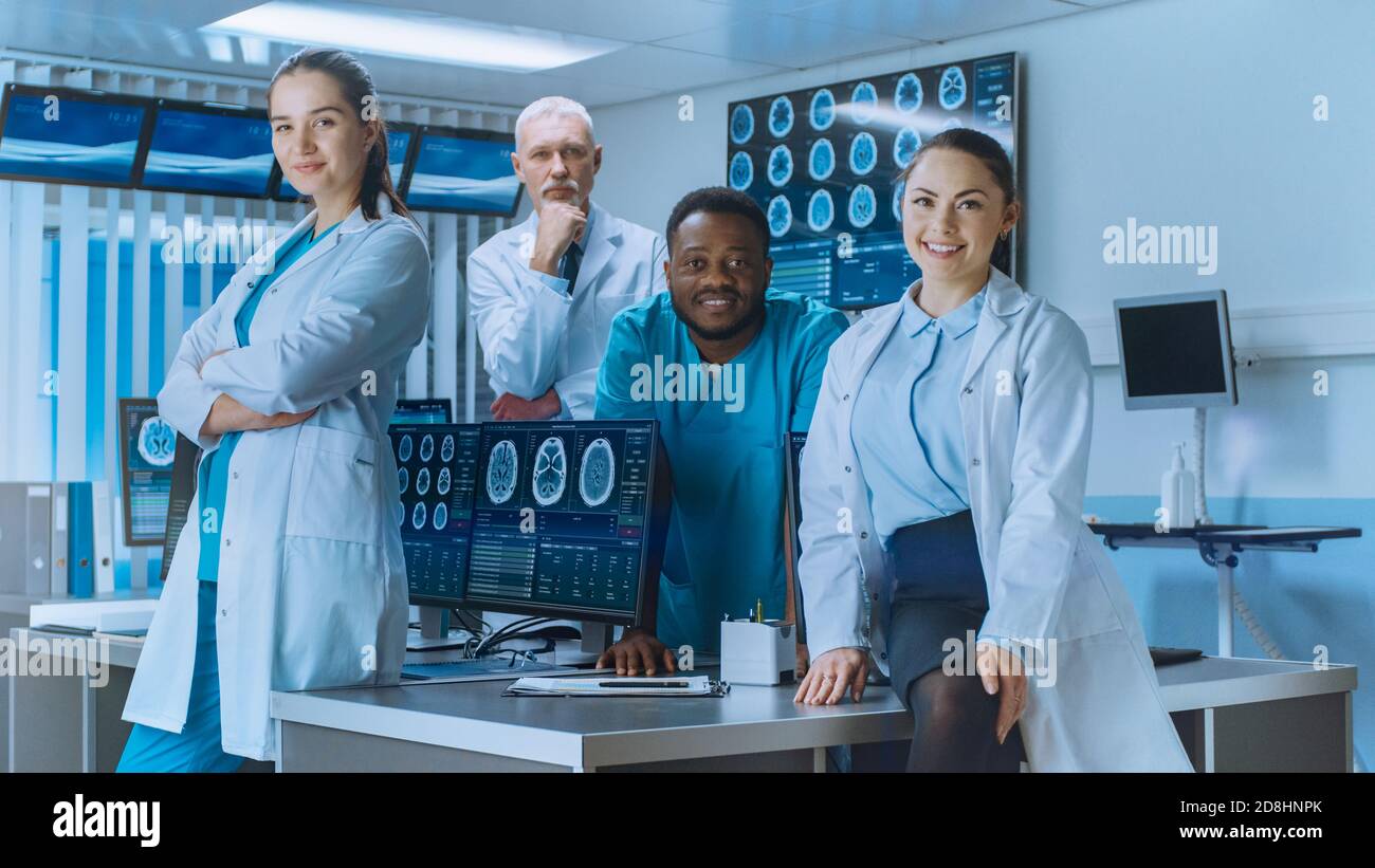 Diverse Team of Medical Scientist Posing with Crossed Arms in the High-Tech Laboratory. Brain Sceince Neurology Center Research Lab with Multiple Stock Photo