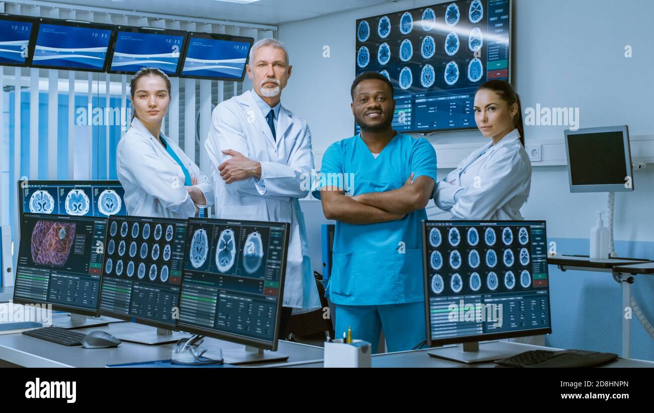 Diverse Team of Medical Scientist Posing with Crossed Arms in the High-Tech Laboratory. Brain Sceince Neurology Center Research Lab with Multiple Stock Photo