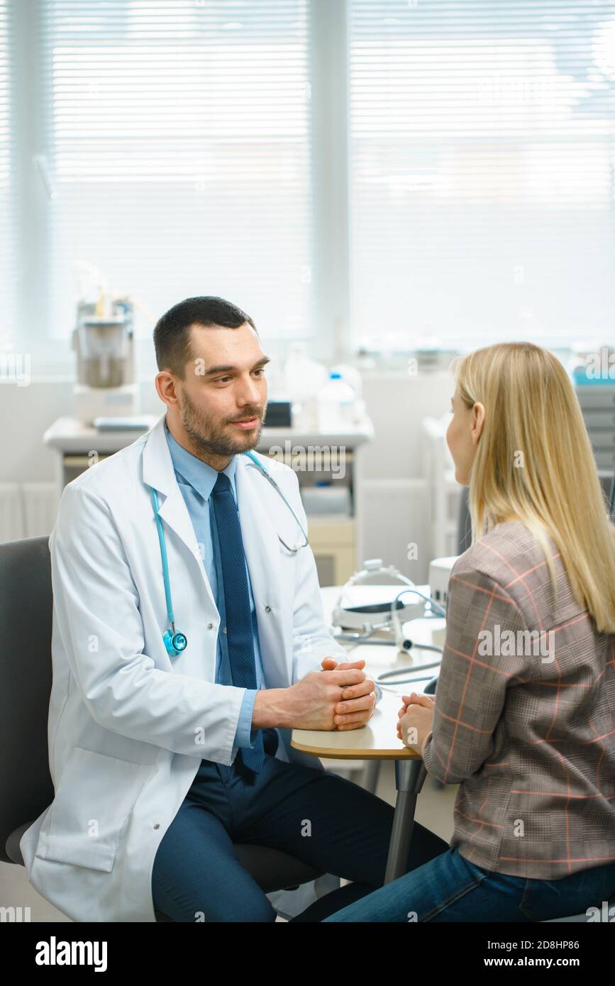 Blonde young woman doctor talks hi-res stock photography and images - Alamy