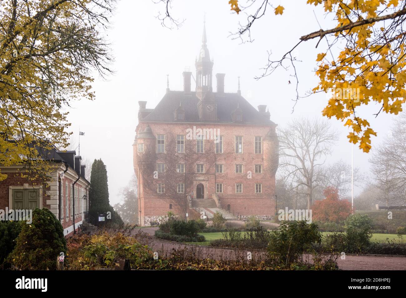 Wik Castle a foggy morning in the end of October. Wik Castle is situated in Uppsala municipality and Balingsta district in Uppsala County. The castle Stock Photo