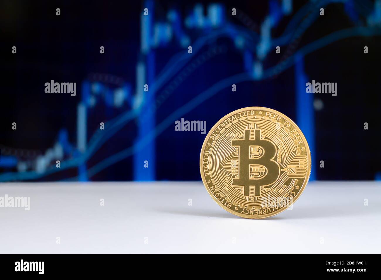 Bitcoin virtual cryptocurrency on chart background Stock Photo