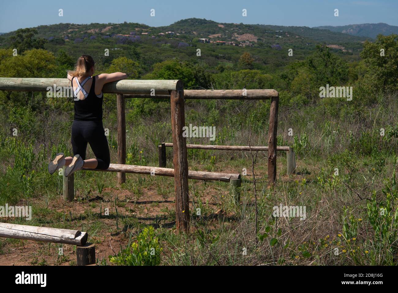 A girl working out outdoors with a beautiful view Stock Photo