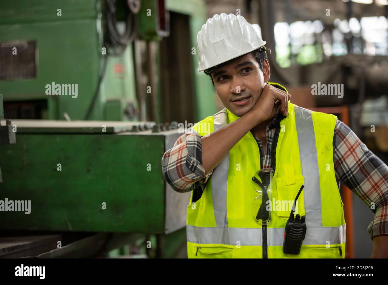 Engineers operating a cnc machine in factory Stock Photo