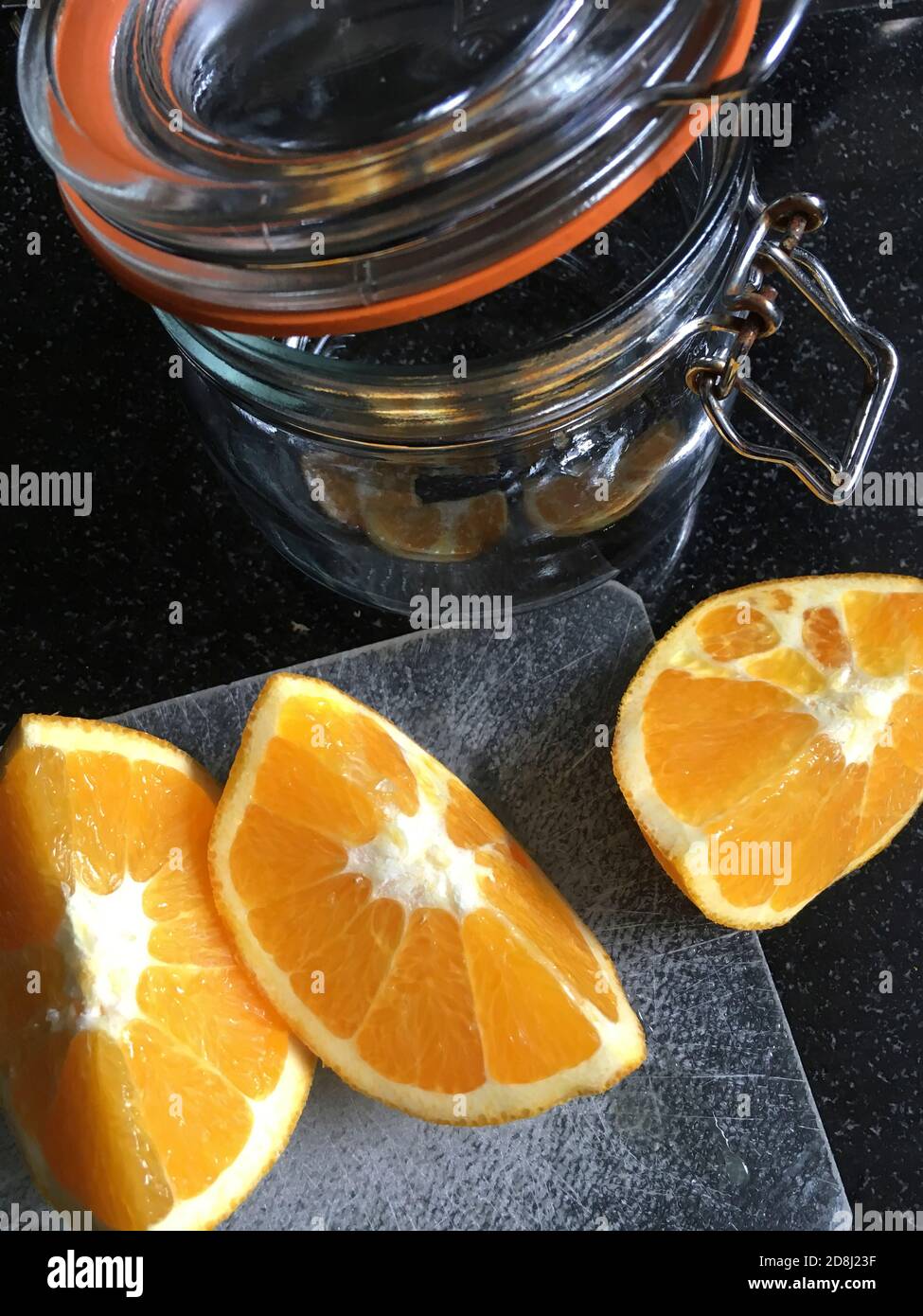 High Angle View of Orange Slices with Glass Jar Stock Photo