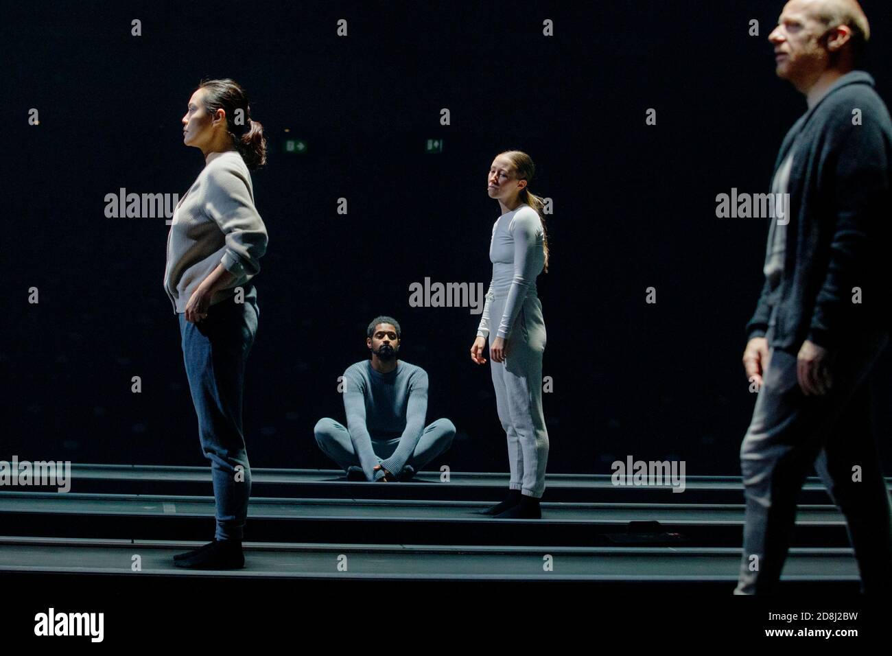 Chichester, West Sussex, UK, October 30, 2020 (L-R) Wendy Kweh as M, Alfred Enoch as B, Erin Doherty as C and Jonathan Slinger as A, perform in Sarah Kane's 'Crave' at the Chichester Festival Theatre, West Sussex, UK Friday October 30, 2020.  Characters move across the stage on travelators during the socially distanced performance. Photograph : Luke MacGregor Credit: Luke MacGregor/Alamy Live News Stock Photo