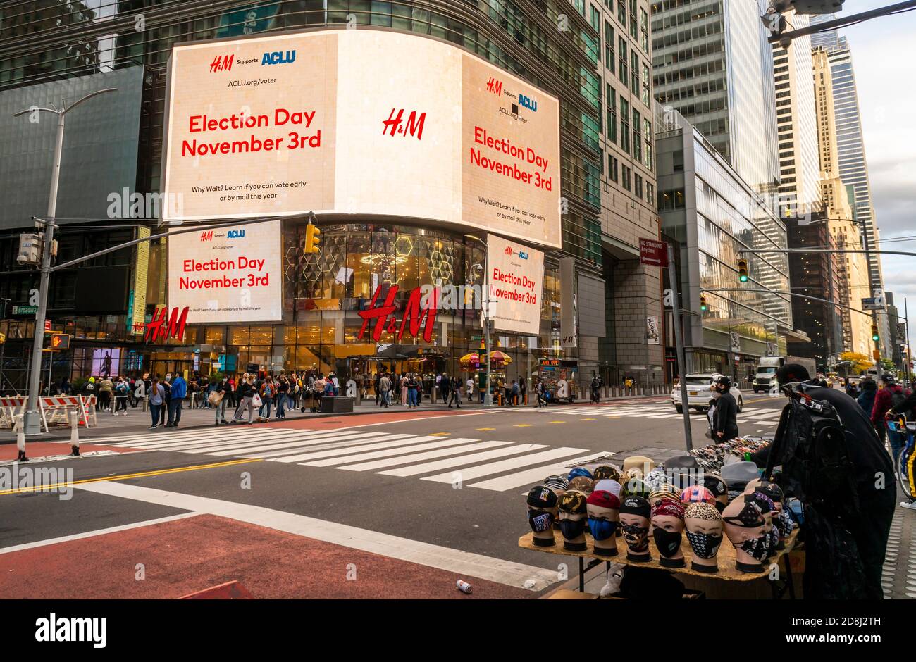 The electronic sign on the H&M department store in Times Square in New York on Saturday, October 24, 2020 reminds voters of election day. (© Richard B. Levine) Stock Photo