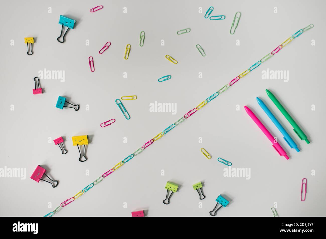 rainbow craft supplies on white table Stock Photo