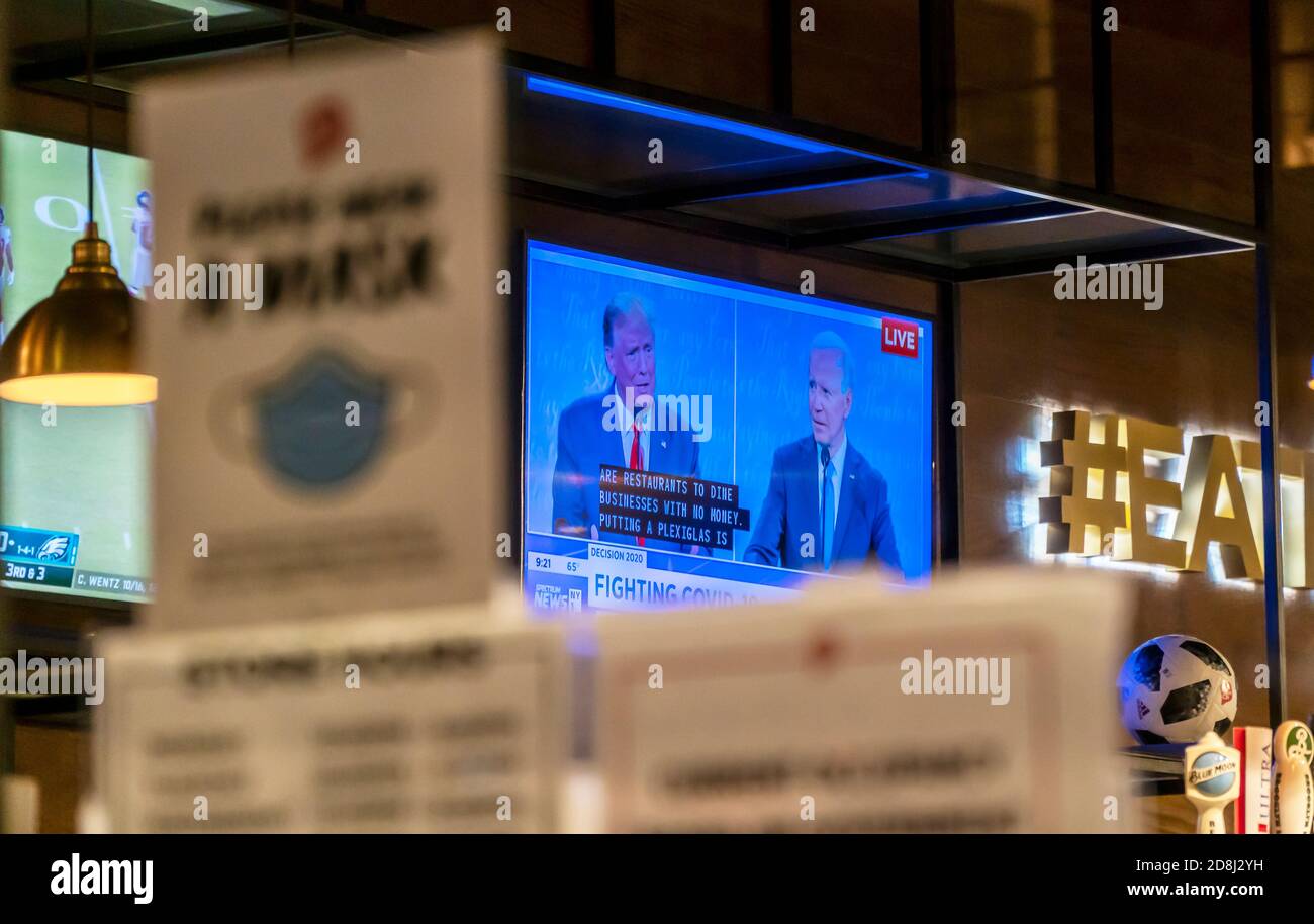 A television in a BonChon Korean Chicken restaurant in Chelsea in New York on Thursday, October 22, 2020 shows the live last presidential debate between Pres. Donald Trump and Senator and Democratic nominee Joe Biden prior to the November 3 election.  (© Richard B. Levine) Stock Photo