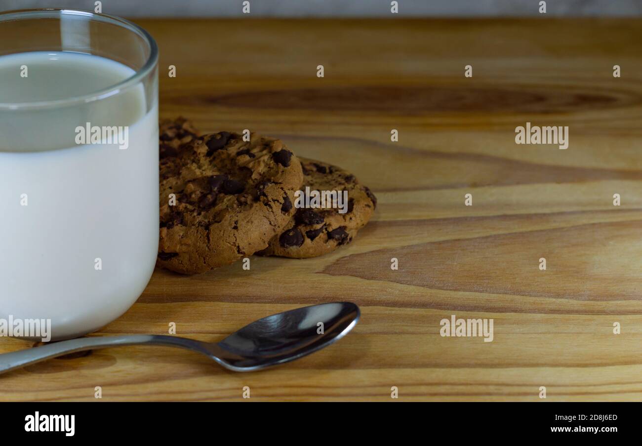 Chocolate Chip Cookies and Milk with spoon Stock Photo