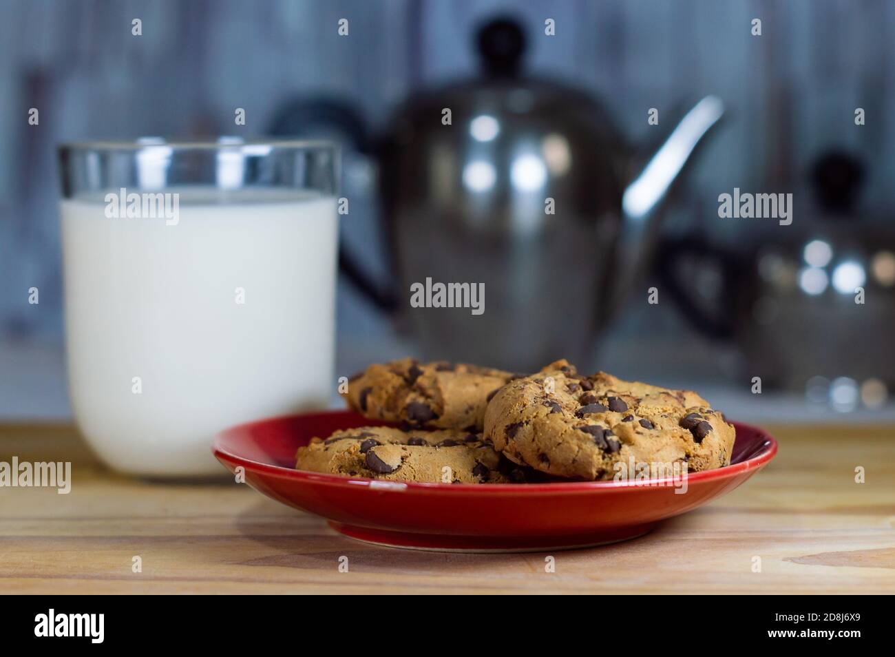 Chocolate Chip Cookies on red plate and Milk Stock Photo