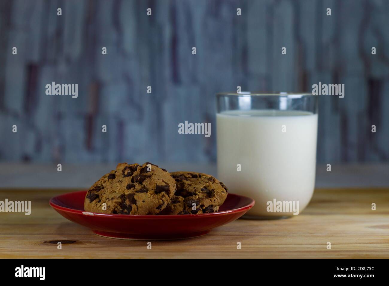 Chocolate Chip Cookies on red plate and Milk Stock Photo