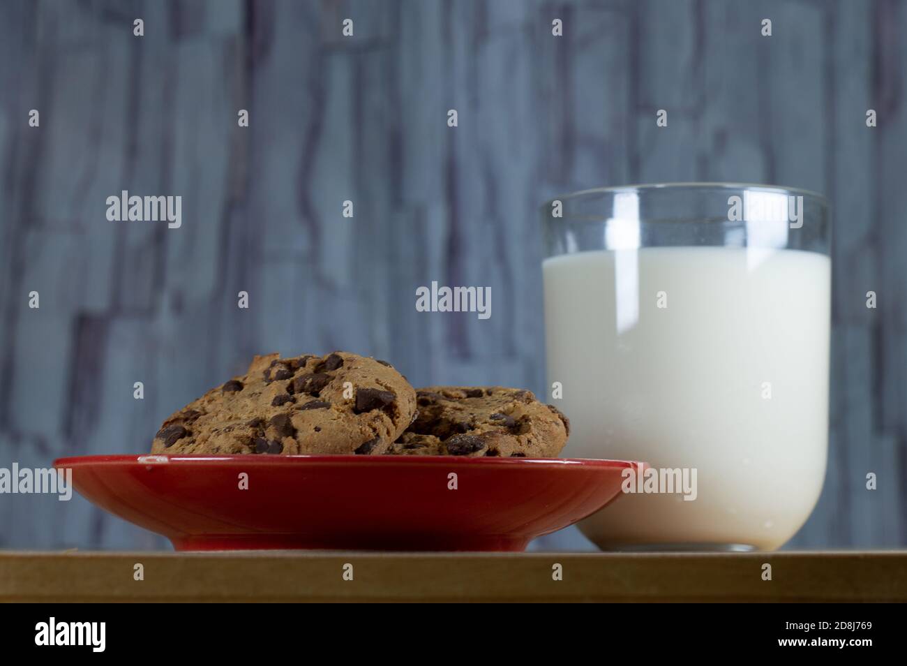 Chocolate Chip Cookies on red plate and Milk Stock Photo