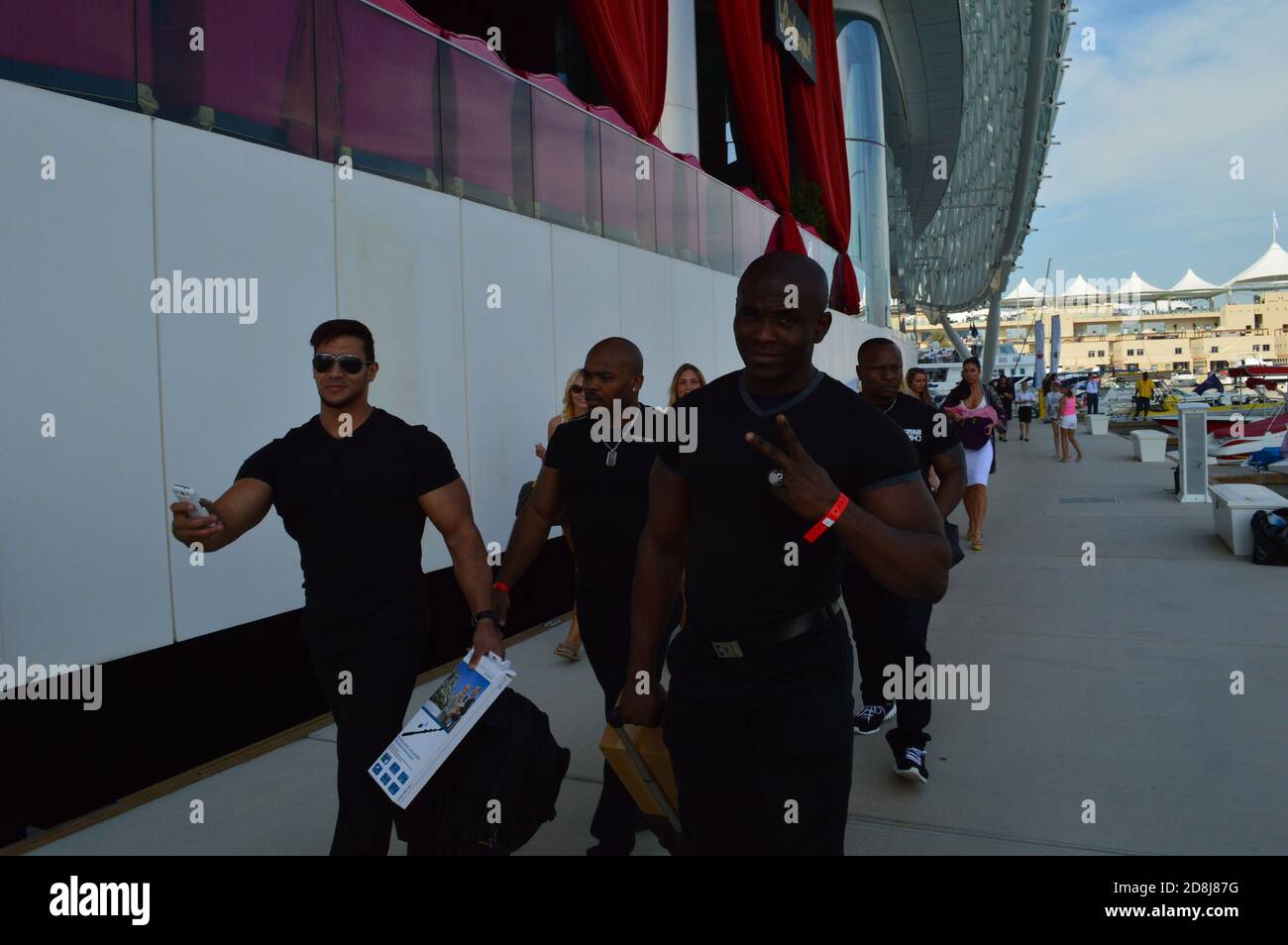 A team of highly skilled and physically fit security personnel escort the premises of Yas Hotel at Yas Marina. Stock Photo