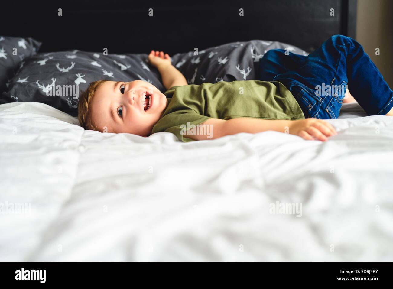 two years old boy on bed portrait Stock Photo Alamy