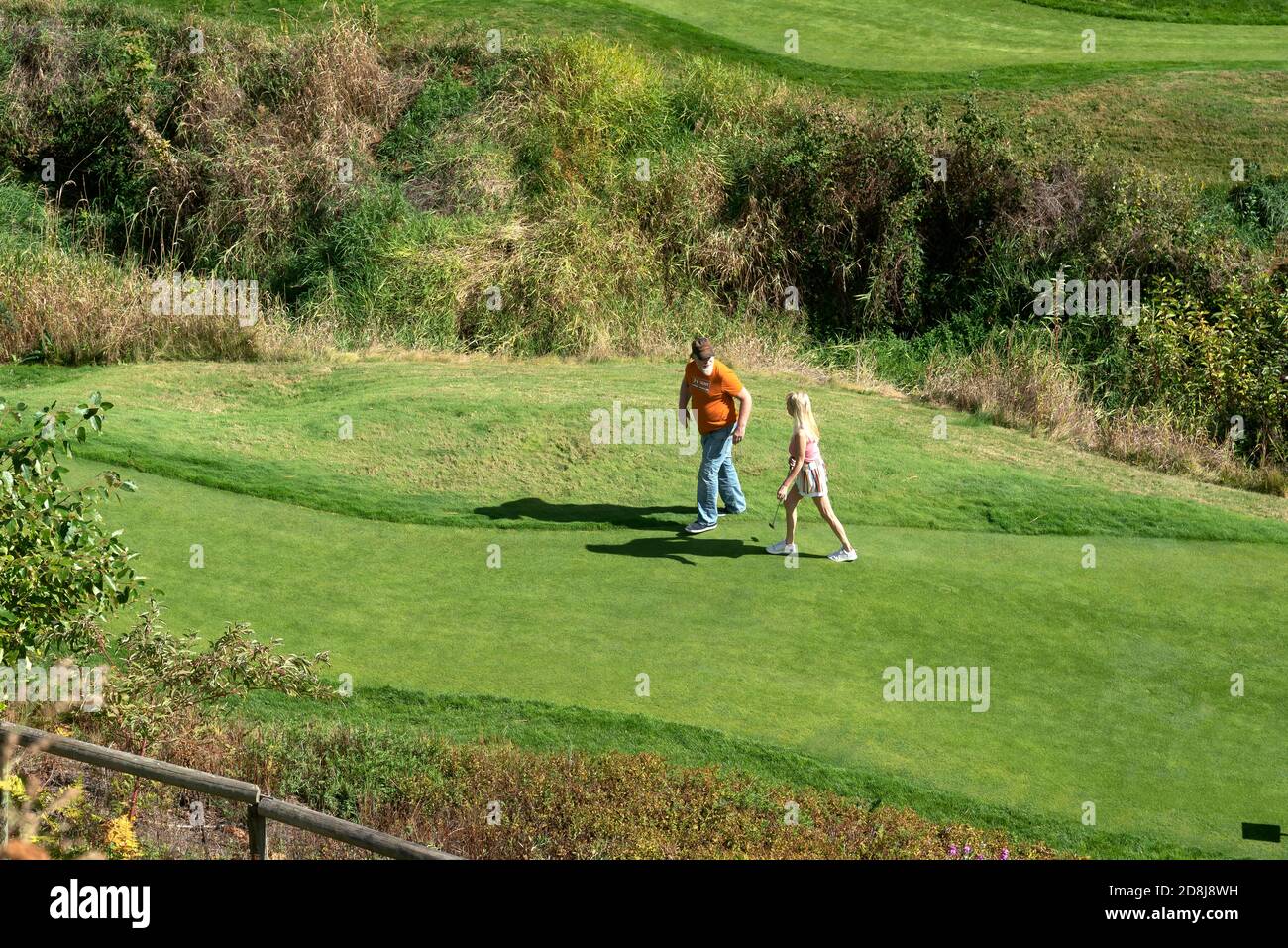 Man and woman playing golf,  Leavenworth, Bavarian-styled village, Washington State, USA Stock Photo