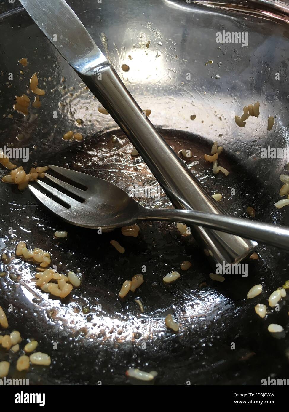 Glass Bowl with eating Utensils Stock Photo