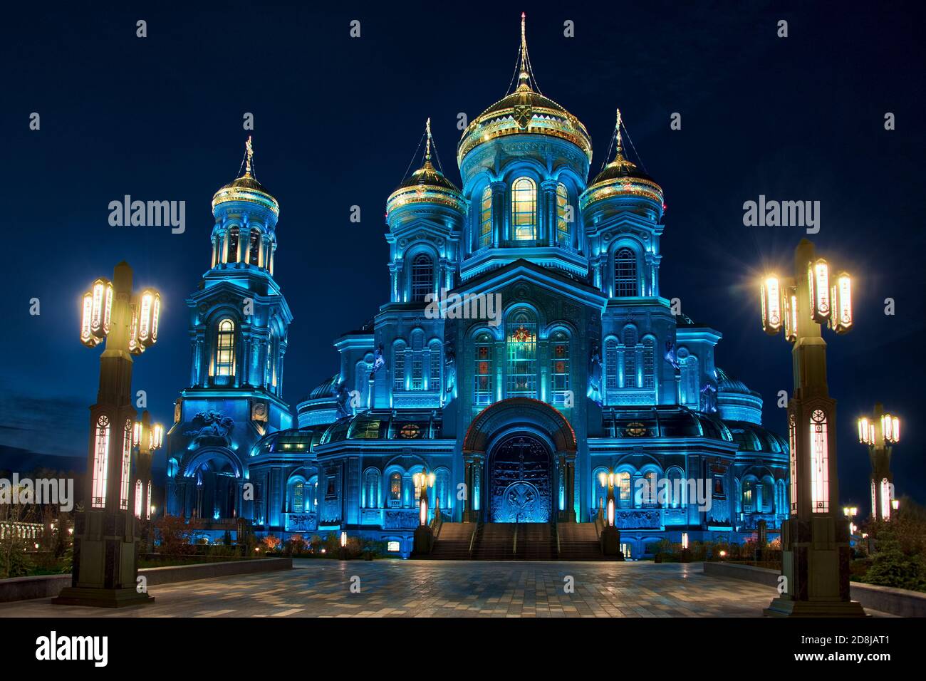 = Resurrection Cathedral in Blue Framed by Street Lamps (South Entrance) =  Framed by street lamps the Southside of the Resurrection Cathedral in Kubi Stock Photo
