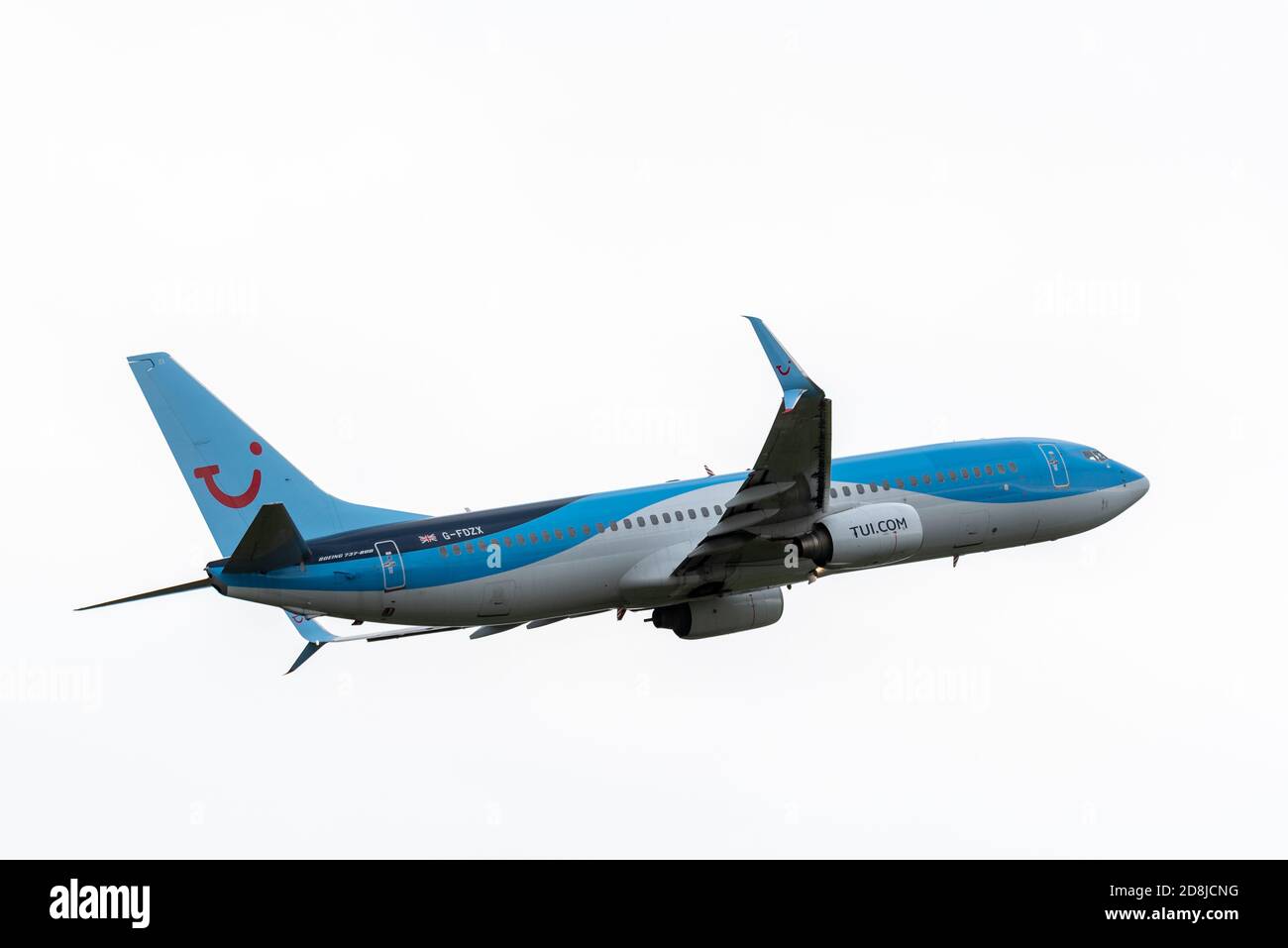 MANCHESTER, UK 30 OCTOBER 2020 - TUI Airways Boeing 737-8K5 flight BY2518 from to Corfu takes off from Manchester Airport in the rain. Stock Photo